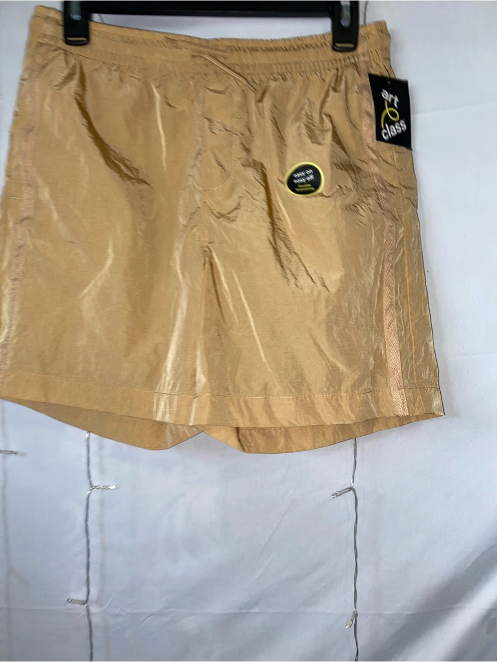 art class tan athletic shorts with subtle logo